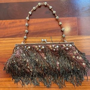 Brown beaded purse. Used once. Animal free, smoke free home.